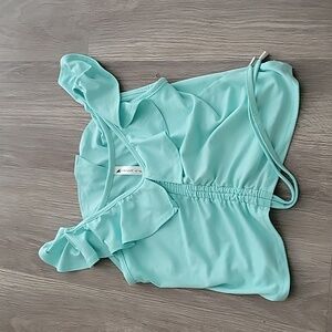 Girls teal t-shirt. Brand= chicca chicc. Size=7-8. Color=Teal